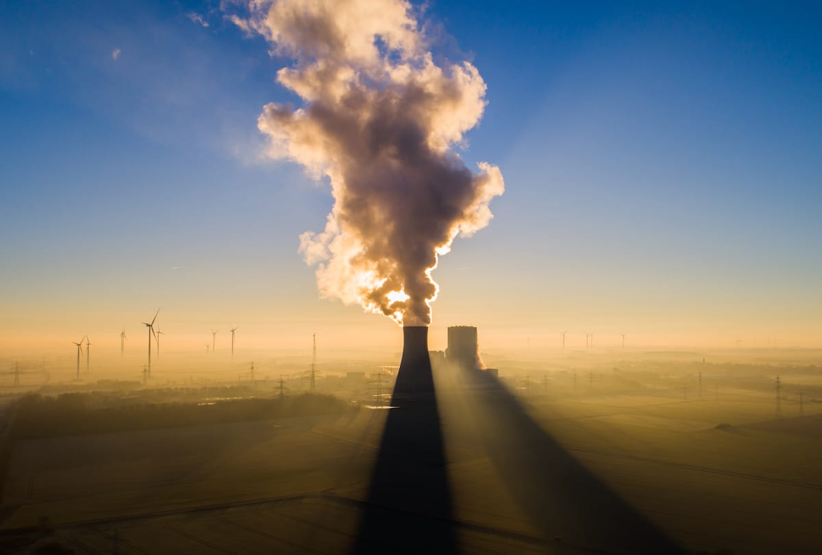 The sun rises behind the coal-fired Mehrum power plant in Lower Saxony, Hohenhameln, Germany