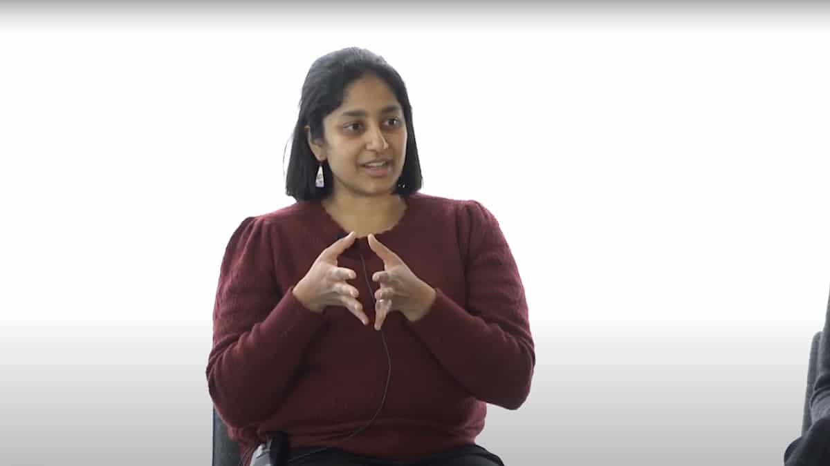 Priya Donti speaks during a panel discussion on computing and AI organized by MIT faculty