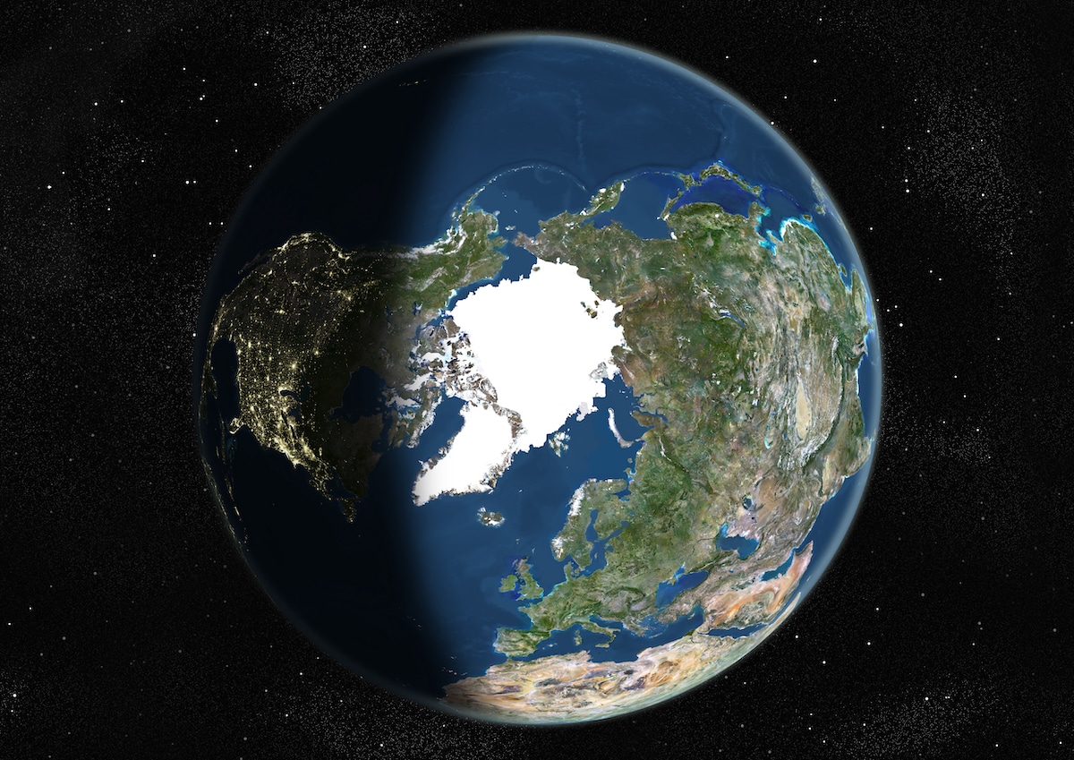 A true color satellite image of the Earth centered on the North Pole during summer solstice at 6 a.m GMT on June 21, 2002. Image in orthographic projection, showing day and night contrast, was compiled from data acquired by LANDSAT 5 & 7 satellites