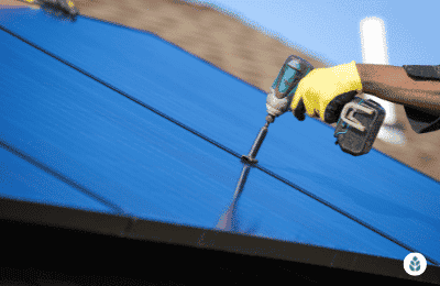 man tightening up solar panel bolts