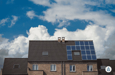 house with half of the roof lined with solar panels